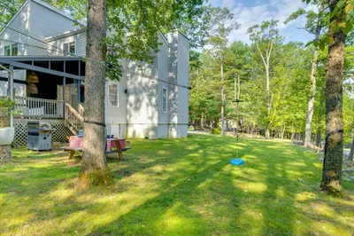 a house with a yard with a blue frisbee at Private Yard, Playset Family Home in Penn Estates in East Stroudsburg