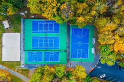 an overhead view of two courts of a tennis court at Private Yard, Playset Family Home in Penn Estates in East Stroudsburg