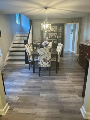 a dining room with a table and chairs and a staircase at Cozy 1 BR Retreat within walking distance to all the Hershey Attractions in Hershey