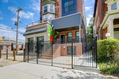 a gate in front of a building at Penthouse Condo with Rooftop Deck in Philadelphia! in Philadelphia