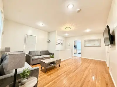 a living room with a couch and a table at Charming Milford Montague Riverway Cottage in Montague