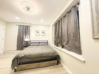 a bedroom with a large bed in a room at Town & Country Andover, NJ Area- Studio Unit in Newton