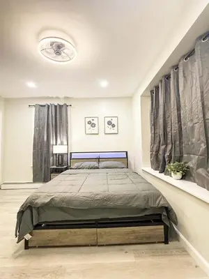 a bedroom with a large bed in a room at Town & Country Andover, NJ Area- Studio Unit in Newton