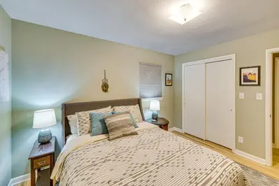 a bedroom with a large bed and two lamps at Near Dtwn Harrisburg Stylish Home with Patio and Yard in Camp Hill