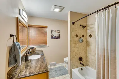 a bathroom with a sink and a toilet and a shower at Near Dtwn Harrisburg Stylish Home with Patio and Yard in Camp Hill