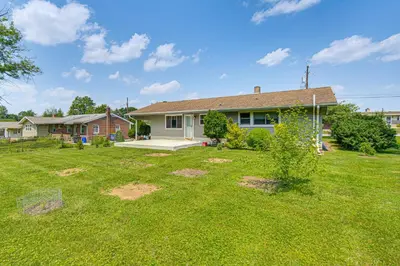 a yard in front of a house with a house at Near Dtwn Harrisburg Stylish Home with Patio and Yard in Camp Hill