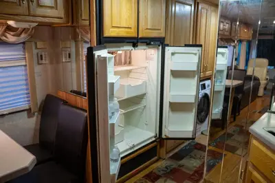 a refrigerator with its door open in a kitchen at Art Rv motorhome in Quakertown