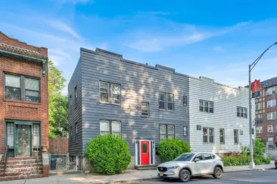 a silver car parked in front of a building at Cozy Garden 1Bed Apt, Lincoln Park in Jersey City