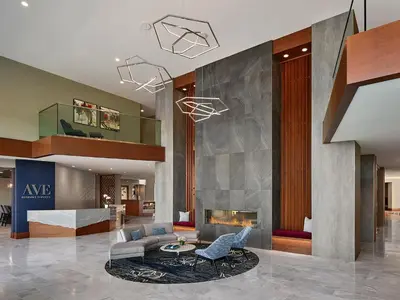 a living room with a couch and a fireplace at AVE Blue Bell - Short Stay Furnished Apartment in Blue Bell