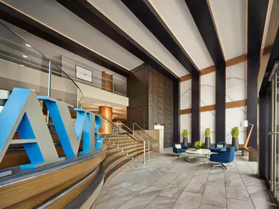 a lobby with a large ak sign on the wall at AVE King of Prussia - Short Stay Furnished Apartment in King of Prussia