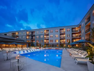 a hotel with a swimming pool and lounge chairs at AVE King of Prussia - Short Stay Furnished Apartment in King of Prussia