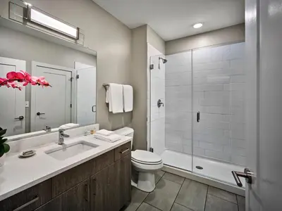 a bathroom with a sink and a toilet and a shower at AVE King of Prussia - Short Stay Furnished Apartment in King of Prussia