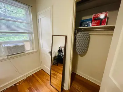 a mirror in the corner of a room with a window at 1BR Near Philly Free Parking, Monthly Discount in Philadelphia