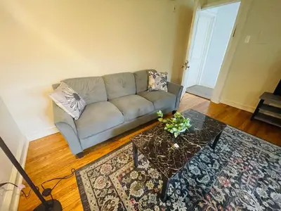 a living room with a couch and a table at 1BR Near Philly Free Parking, Monthly Discount in Philadelphia
