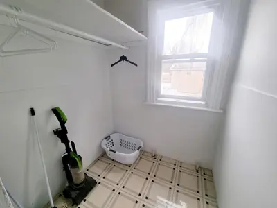 a room with a kitchen with a window and a tool at Cozy & Inviting A Place to Call Home in Melrose Park