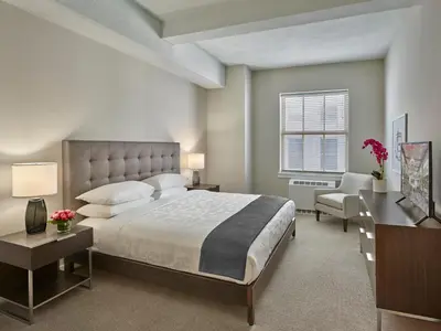 a large bedroom with a large bed and a desk at The Franklin Residences - Extended Stay Furnished Apartment, Philadelphia PA in Philadelphia