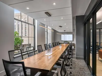 a conference room with a long table and chairs at The Franklin Residences - Extended Stay Furnished Apartment, Philadelphia PA in Philadelphia