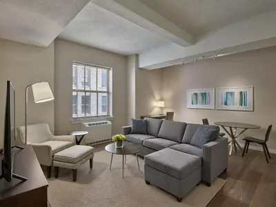 a living room with a couch and a table at The Franklin Residences - Extended Stay Furnished Apartment, Philadelphia PA in Philadelphia