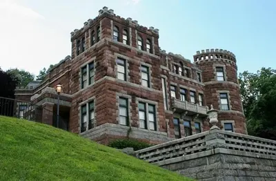 a large brick building on top of a hill at Bright, Stylish and Comfy Luxury Room With Workspace! in Haledon