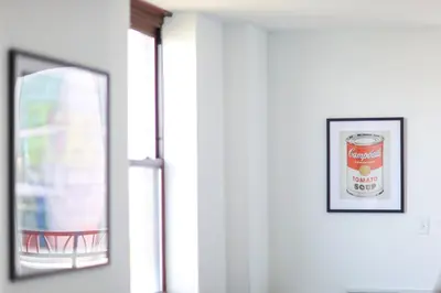 a window with a picture of a can of soup at Hudson River waterfront apt w sweeping NYC views in Hoboken