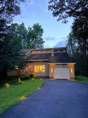 a house with a garage and a driveway at Modern Home - Privacy - Prime Location - 18min Camelback Ski Resort in Tobyhanna