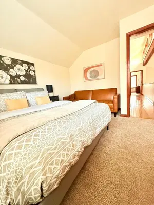 a bedroom with a large bed in a room at Modern Home - Privacy - Prime Location - 18min Camelback Ski Resort in Tobyhanna