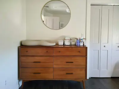 a dresser with a mirror on top of it at Luxe Gabel Farmhouse Fire Pit & Country Views in Callicoon