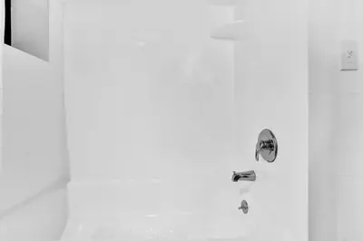 a shower with a faucet in a bathroom at Gramercy Apartment - 3BR 2BA Modern Central in New York