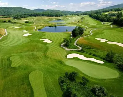 an aerial view of a golf course with a pond at Cozy Studio Resort Stay Mountain Creek Pool Hiking in Vernon Township