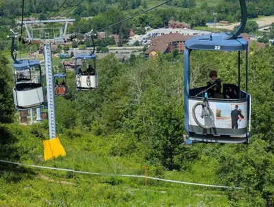 a group of people riding on a ski lift at Cozy Studio Resort Stay Mountain Creek Pool Hiking in Vernon Township