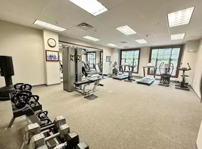 a gym with several treadmills and elliptical machines at Cozy Studio Resort Stay Mountain Creek Pool Hiking in Vernon Township