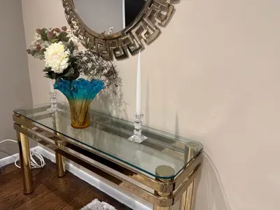 a glass table with a vase of flowers and a mirror at NY City View West Orange Villa 5 bedroom in West Orange