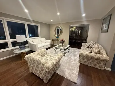 a living room with two couches and a table at NY City View West Orange Villa 5 bedroom in West Orange