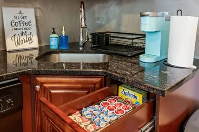 a kitchen counter with a drawer full of food at New Modern Apt in Chinatown Parking Available in Philadelphia