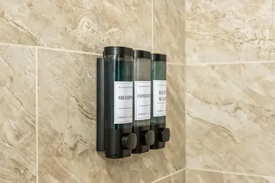 a group of wine bottles on a wall at New Modern Apt in Chinatown Parking Available in Philadelphia