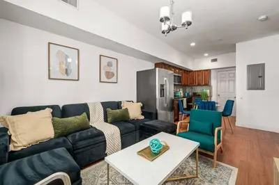 a living room with a couch and a table at New Modern Apt in Chinatown Parking Available in Philadelphia