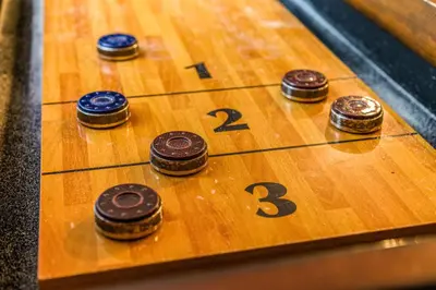 a game of dominoes on a wooden table at Lake Harmony Getaway in Lake Harmony