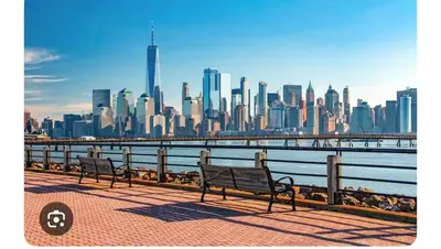 two benches on a pier with a view of a city at NYCRiverside 2BR Apt 20MintsTime Square in West New York