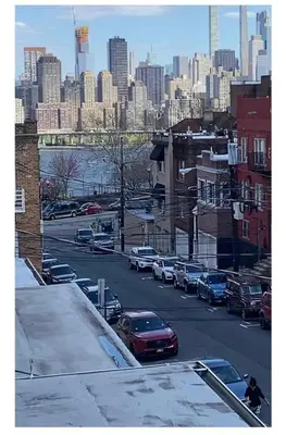 a view of a city with cars parked on a street at NYCRiverside 2BR Apt 20MintsTime Square in West New York