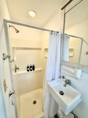 a bathroom with a sink and a shower at RiverEdge Apt Gateway20Mints FromTime SquareNYC in West New York