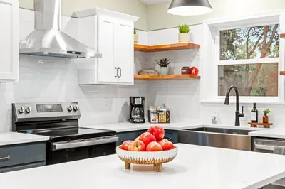a kitchen with a bowl of fruit on a counter at The Respite getaway in Harrisburg