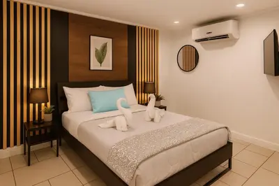 a bedroom with a bed with two swans on it at Nice 3BR Apt | 3 Beds |15 Min to NYC/Manhattan! in North Bergen