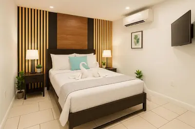 a bedroom with a bed with two swans on it at Nice 3BR Apt | 3 Beds |15 Min to NYC/Manhattan! in North Bergen