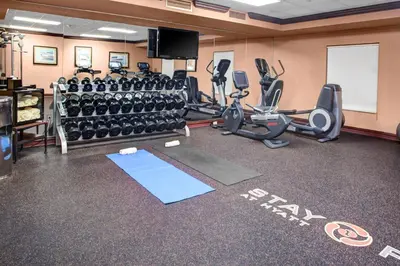 a gym with treadmills and exercise equipment in a room at Hyatt House Parsippany East in Parsippany