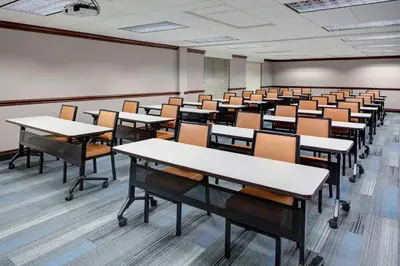 an empty classroom with rows of desks and chairs at Hyatt House Parsippany East in Parsippany
