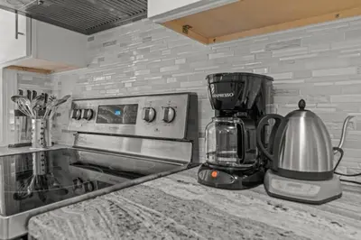 a kitchen counter with a coffee maker and a blender at Chestnut Hill 2BR Easy Parking in Philadelphia