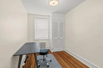 an empty room with a desk and a chair at Chestnut Hill 2BR Easy Parking in Philadelphia