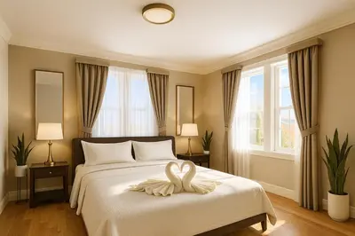 a bedroom with a bed with a white towel on it at 2 BR Apt|15 Min to NYC|Book Today in North Bergen