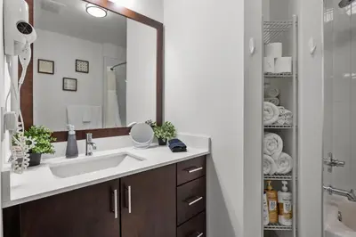 a bathroom with a sink and a mirror at Luxury 1BR Apt-Pool RWJ-Rutgers StPeter-Free Parking - NYC316 in New Brunswick