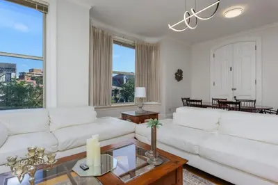 a living room with a white couch and a table at Capitol View Retreat - 2F Fast Wi-Fi Spacious in Harrisburg